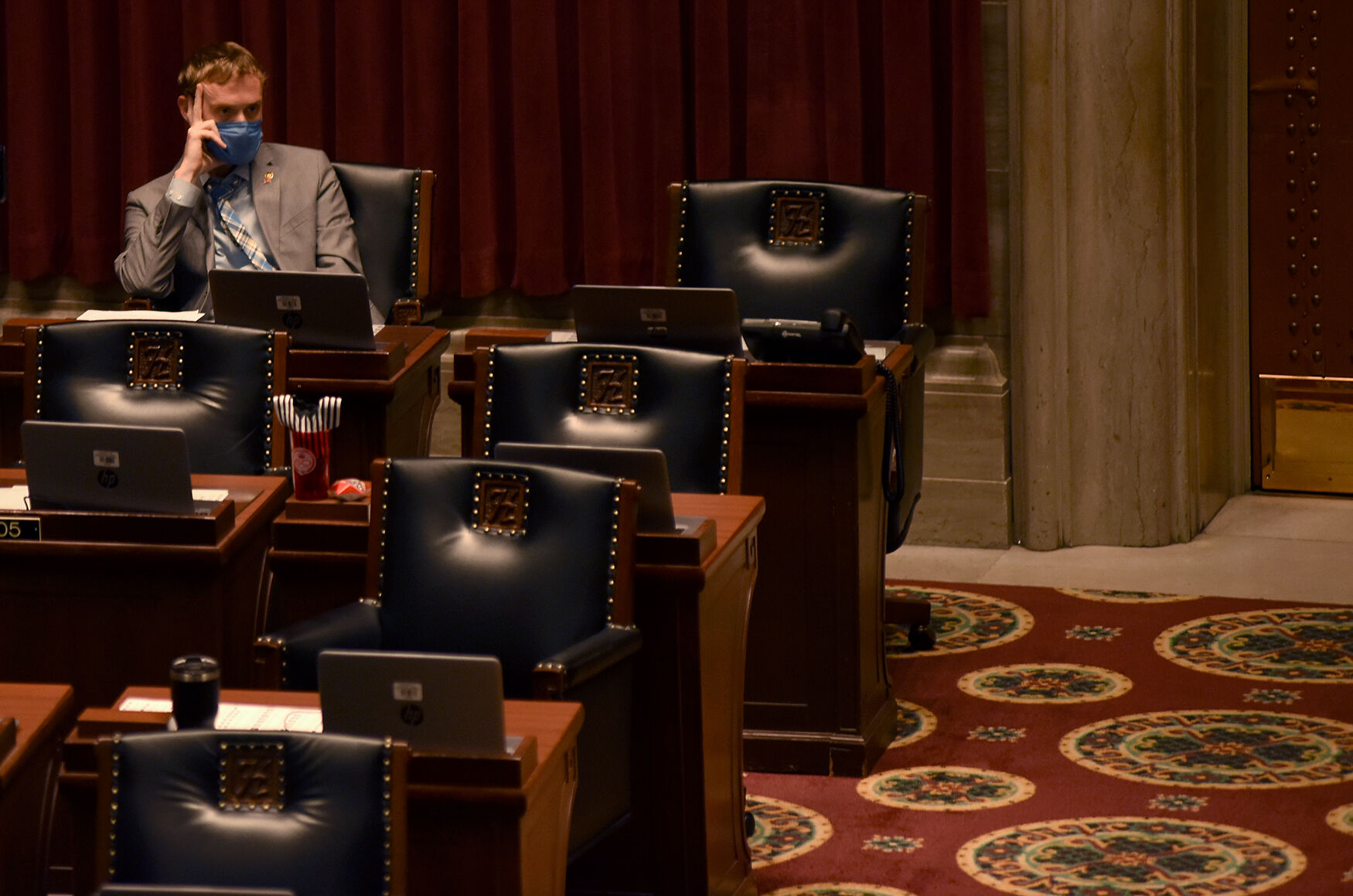 Rep. Peter Merideth listens to Nikki Strong